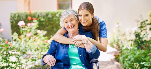 A senior care nurse with her guest in the villa.